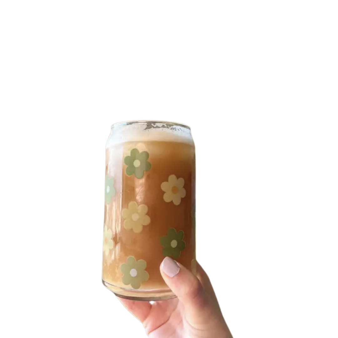 Glass cup with different green colored flowers.  This 16 oz can glass cup is a great choice for hot and cold beverages. Its Daisy design is printed seamlessly around the glass with high-quality, durable ink for long-lasting durability. Plus, it is dishwasher safe and can last through more than 300 dishwasher cycles on the top rack.